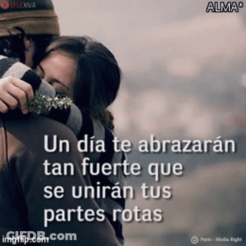 A Man And Woman Hugging With A Quote In Spanish On The Bottom GIF