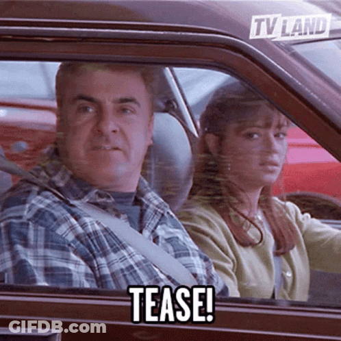 A Man And Woman In A Car With A Tv Land Sticker On The Back Window GIF
