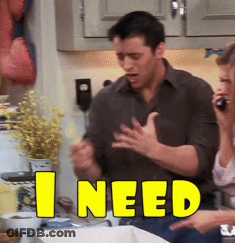 A Man And Woman In A Kitchen With The Word I Need In Yellow GIF