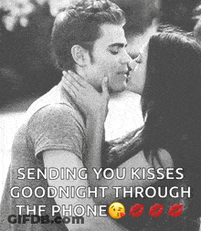 A Man And Woman Kissing With The Words Sending You Kisses Goodnight Through The Phone Below Them GIF