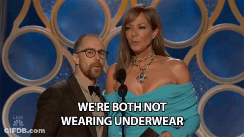 A Man And Woman On A Stage With The Words We 'Re Both Not Wearing Underwear Behind Them GIF
