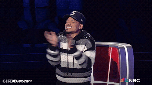 A Man Applauds While Wearing A Hat That Says ' S ' On It GIF