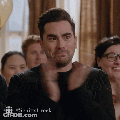 A Man Applauds With A #Schitts Creek Watermark GIF