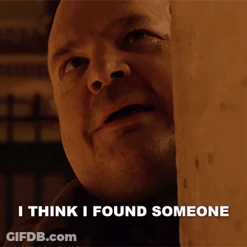 A Man Behind A Wall With The Words I Think I Found Someone Written Below Him GIF