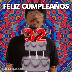 A Man Blowing Out Candles On A Cake That Says 32 GIF