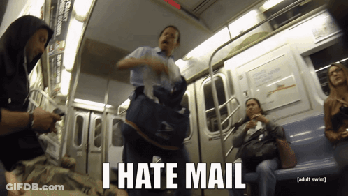 A Man Carrying A Bag On A Subway Train Says " I Hate Mail " GIF