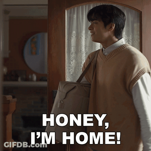 A Man Carrying A Bag With The Words Honey I 'M Home GIF
