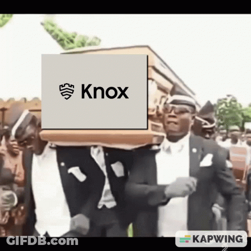 A Man Carrying A Coffin With Knox On It GIF