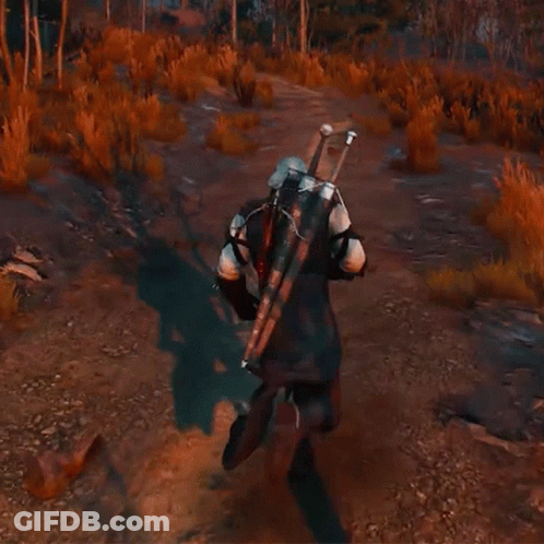 A Man Carrying A Large Sword On His Back Is Walking Down A Dirt Road . GIF