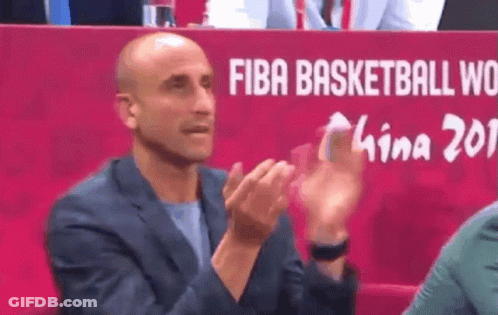 A Man Clapping In Front Of A Fiba Basketball World Sign GIF