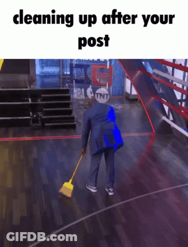 A Man Cleaning Up A Basketball Court With A Tnt Logo In The Background GIF