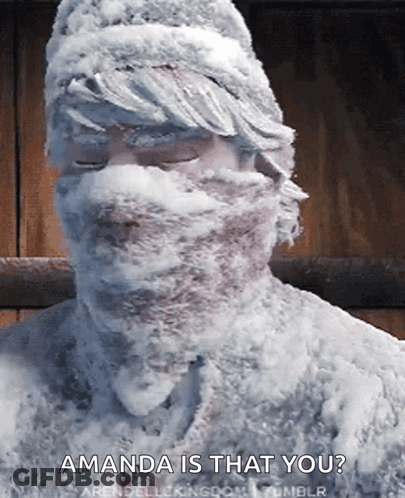 A Man Covered In Snow With The Words Amanda Is That You GIF