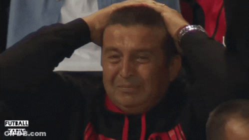 A Man Covering His Ears While Wearing A Watch And A Shirt That Says " Futbol Karim " GIF