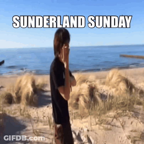 A Man Covering His Face On A Beach With The Words Sunderland Sunday Written Above Him GIF