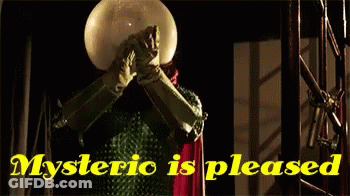 A Man Covering His Face With A Ball And The Words " Mysteric Is Pleased " Below Him GIF