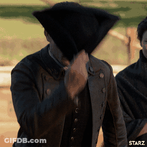 A Man Covering His Face With A Black Hat With Starz Written On The Bottom Left GIF