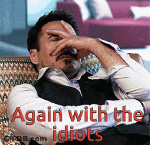 A Man Covering His Face With His Hand And The Words Again With The Idiots GIF