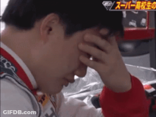 A Man Covering His Face With His Hand In A Video With Chinese Writing On It GIF