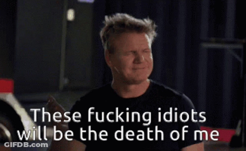 A Man Covering His Face With His Hand With The Words " These Fucking Idiots Will Be The Death Of Me " GIF