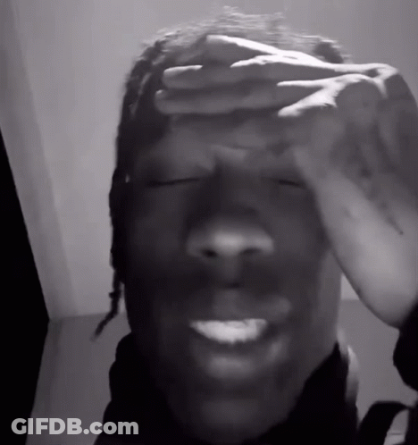 A Man Covering His Face With His Hands And Smiling GIF