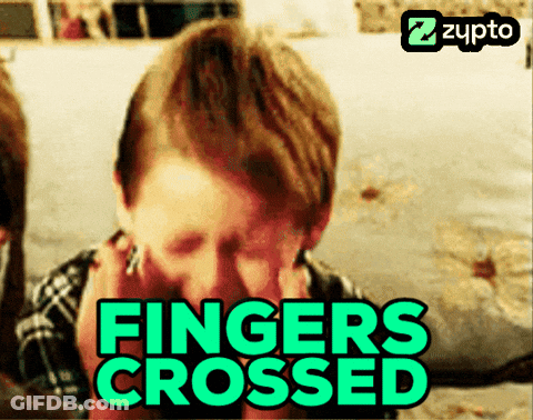 A Man Covering His Face With His Hands And The Words Fingers Crossed GIF