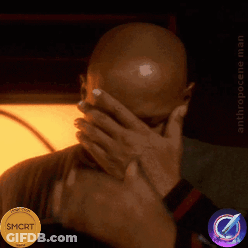 A Man Covering His Face With His Hands Next To A Coin That Says $ Mort GIF
