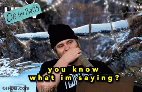 A Man Covering His Mouth With His Hand And A Sign That Says " Off The Rails " Behind Him GIF