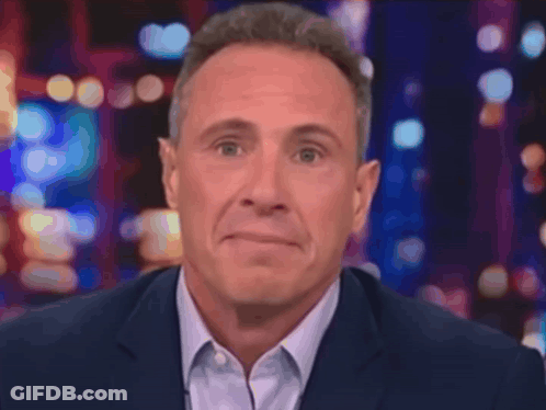 A Man Covering His Mouth With His Hands With A Ring On His Finger GIF