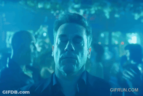 A Man Dancing In A Club With A Gifrun.com Watermark GIF