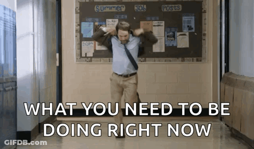 A Man Dancing In A Hallway With The Words What You Need To Be Doing Right Now GIF