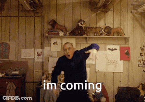 A Man Dancing In A Room With The Words Im Coming GIF