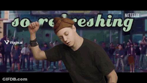 A Man Dancing In Front Of A Sign That Says Netflix GIF