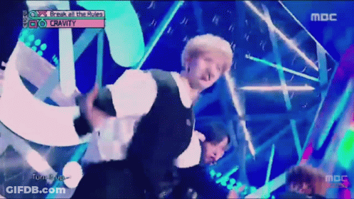 A Man Dancing On A Stage With The Words Break All The Rules Written Above Him GIF