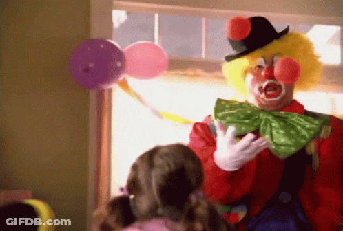 A Man Dressed As A Clown Is Talking To A Little Girl GIF