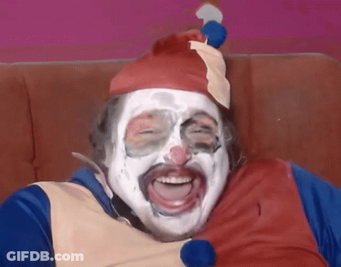 A Man Dressed As A Clown With White Paint On His Face GIF