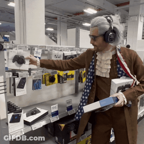A Man Dressed As Abraham Lincoln Is Holding A Box Of Xbox One GIF