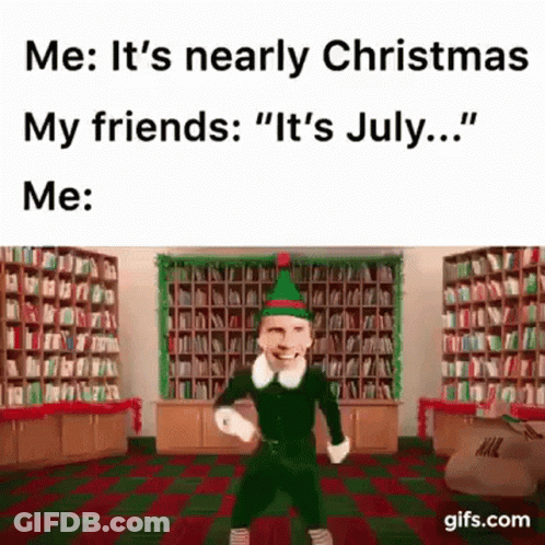 A Man Dressed As An Elf Is Dancing In A Library With A Caption That Says `` It 'S July ... '' . GIF