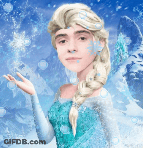 A Man Dressed As Elsa From Frozen With Snowflakes On His Face GIF