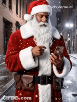 A Man Dressed As Santa Claus Looking At His Cell Phone GIF