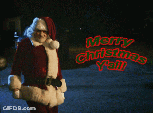 A Man Dressed As Santa Claus Says Merry Christmas Y'all In Red Letters GIF