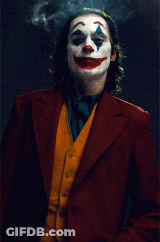 Man Dressed As Joker Smoking Cigar GIF