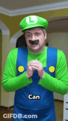 A Man Dressed In A Luigi Costume Has The Word Can On His Shirt GIF