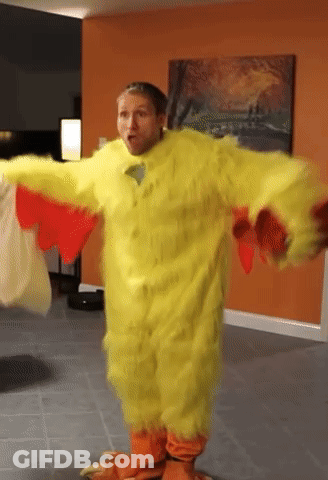 A Man Dressed In A Yellow Chicken Costume GIF
