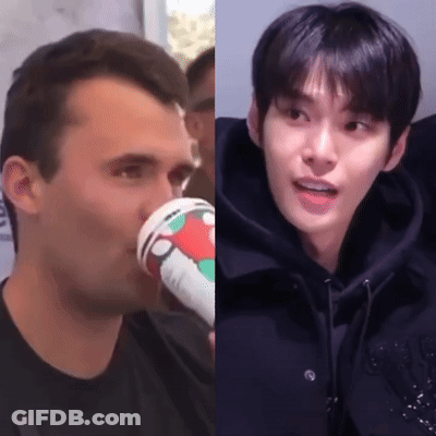 A Man Drinking A Cup Of Coffee Next To A Man Drinking From A Cup . GIF