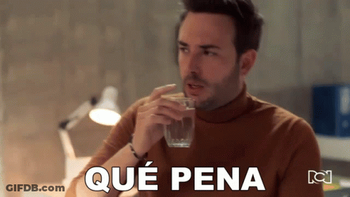 A Man Drinking A Glass Of Water With Que Pena Written On The Bottom Of The Image GIF