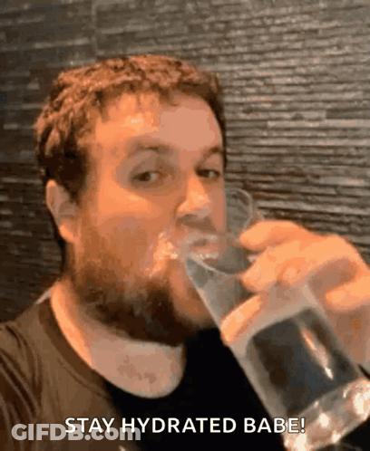 A Man Drinking A Glass Of Water With The Words Stay Hydrated Babe GIF