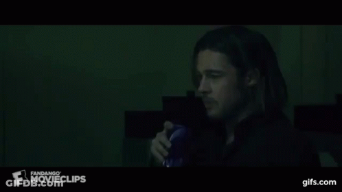 A Man Drinking From A Blue Cup With A Fandango Movie Clips Logo On The Bottom GIF