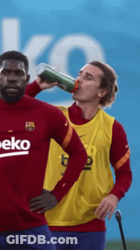 A Man Drinking From A Bottle With The Word Beko On His Shirt GIF