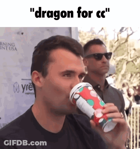 A Man Drinking From A Cup That Says Dragon For Cc On It GIF