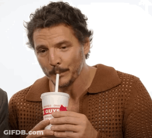 A Man Drinking From A Cup That Says Guys GIF